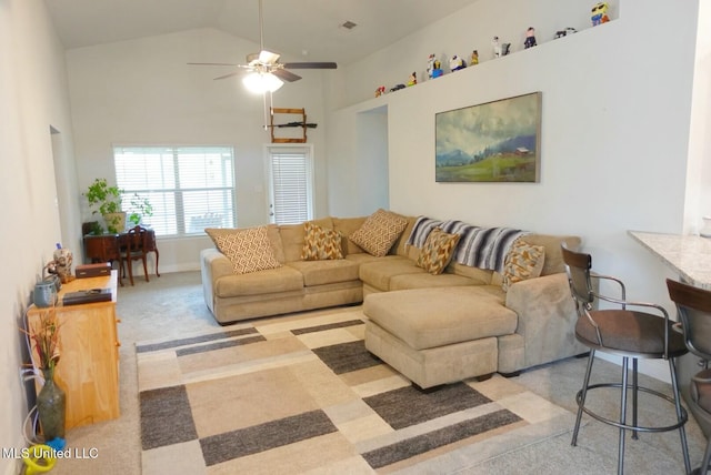 living room featuring high vaulted ceiling and a ceiling fan