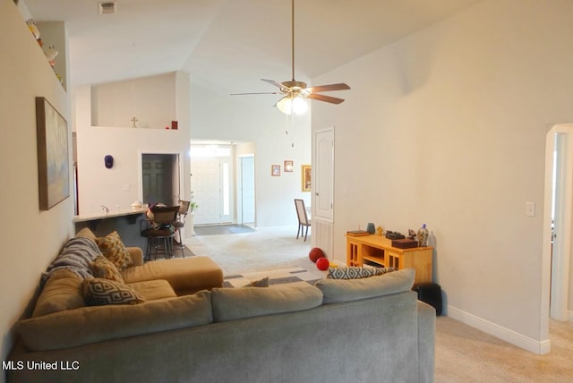 living room featuring high vaulted ceiling, light carpet, visible vents, and a ceiling fan