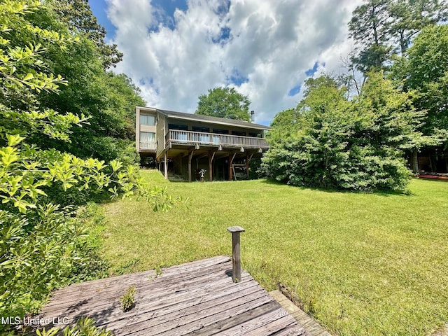577 W Lakeshore Dr, Carriere, MS 39426 - back of property with a yard and a deck