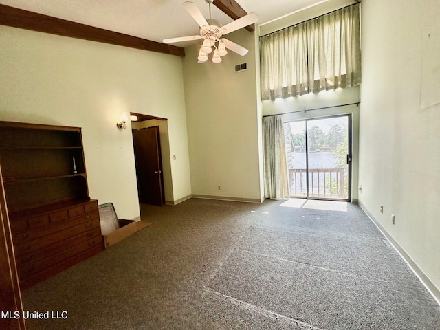 577 W Lakeshore Dr, Carriere, MS 39426 - unfurnished living room featuring a high ceiling, carpet, ceiling fan, and baseboards