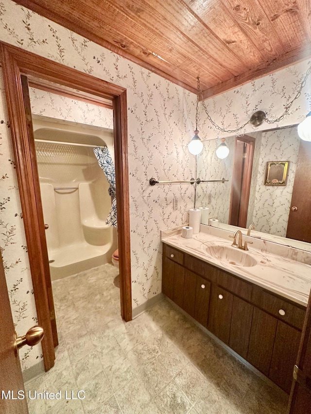 577 W Lakeshore Dr, Carriere, MS 39426 - bathroom with wood ceiling, vanity, tile patterned floors, toilet, and baseboards
