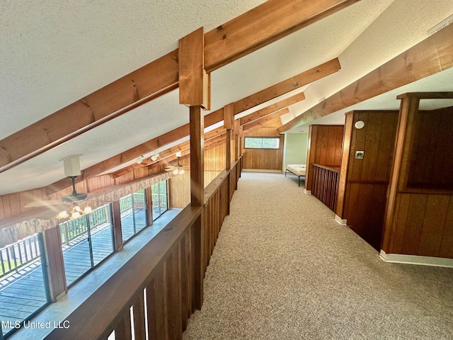 577 W Lakeshore Dr, Carriere, MS 39426 - corridor with wooden walls, carpet floors, plenty of natural light, and a textured ceiling