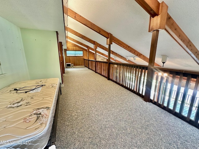 577 W Lakeshore Dr, Carriere, MS 39426 - hall with carpet, a textured ceiling, beamed ceiling, and wood walls