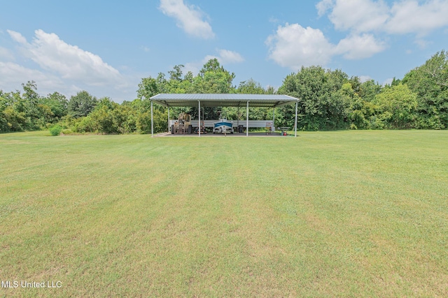 5004 Oak St, Bay Saint Louis, MS 39520 - view of green lawn featuring a detached carport