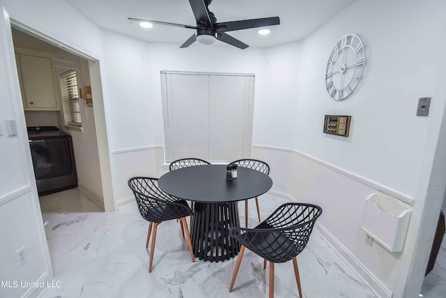 dining room featuring washer / dryer and ceiling fan