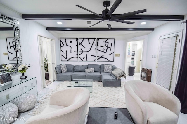 living room with beam ceiling and ceiling fan