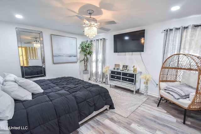 bedroom with hardwood / wood-style flooring and ceiling fan