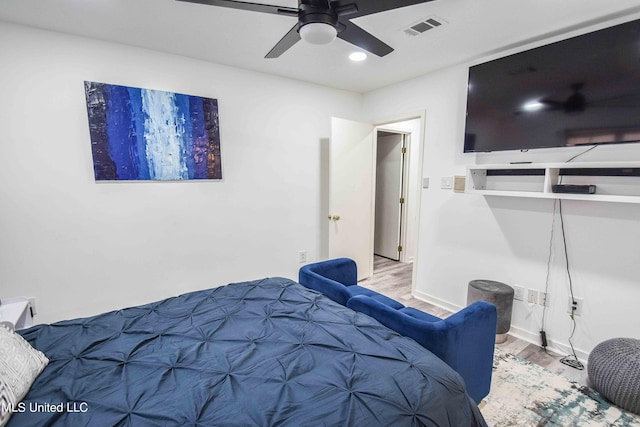 bedroom featuring light wood-type flooring and ceiling fan