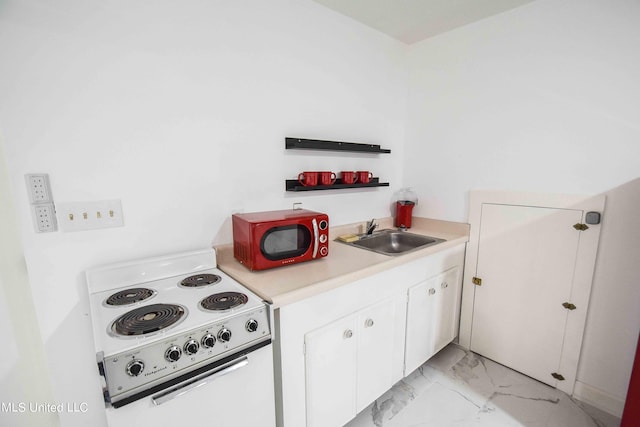 kitchen featuring white electric range, white cabinets, and sink