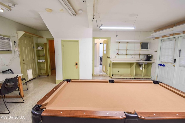 rec room featuring an AC wall unit and billiards