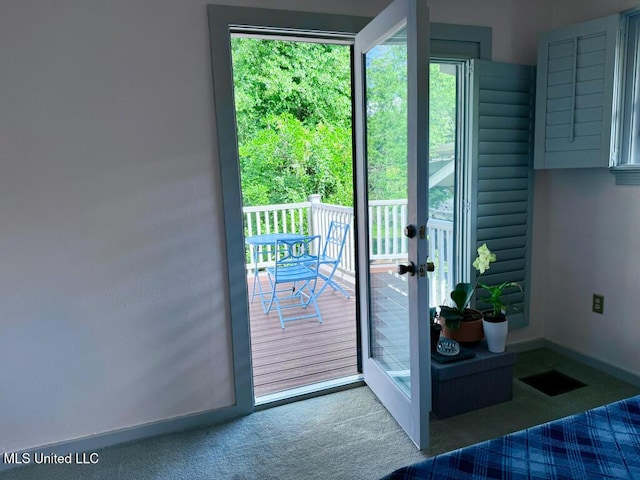 doorway to outside featuring carpet floors and french doors