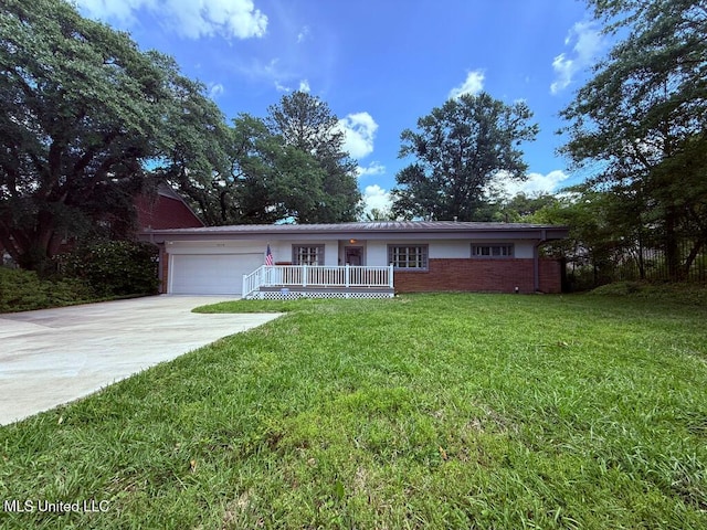 ranch-style home with a front lawn, covered porch, brick siding, concrete driveway, and an attached garage