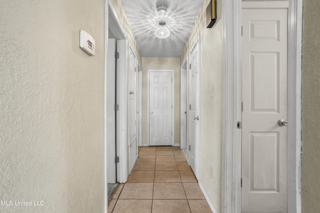 corridor featuring light tile patterned floors