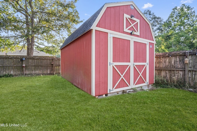 view of outbuilding with a lawn