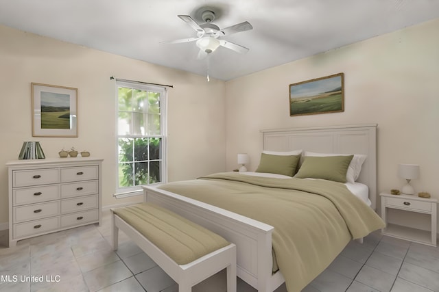 tiled bedroom with ceiling fan