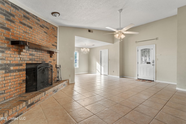 unfurnished living room with lofted ceiling, light tile patterned floors, a fireplace, a textured ceiling, and ceiling fan with notable chandelier