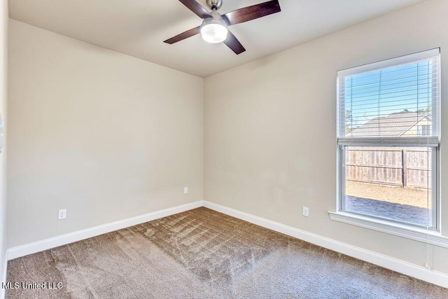 unfurnished room featuring carpet floors and ceiling fan