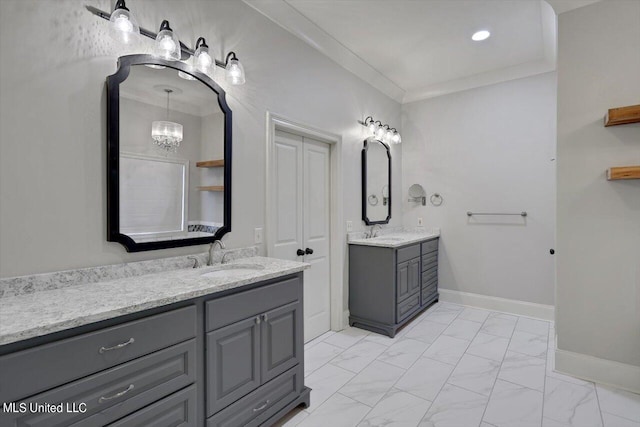 bathroom with vanity and ornamental molding