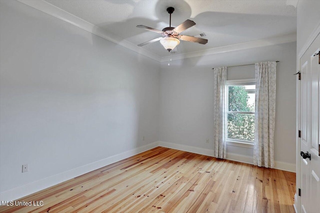 unfurnished room with crown molding, light hardwood / wood-style flooring, a textured ceiling, and ceiling fan