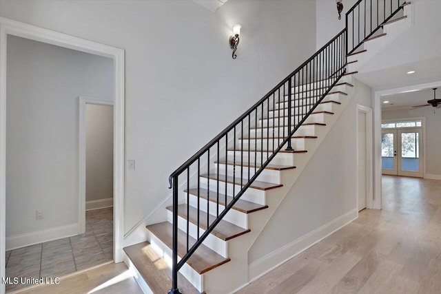 111 Southampton Cir, Madison, MS 39110 - stairs featuring a ceiling fan, wood finished floors, french doors, and baseboards