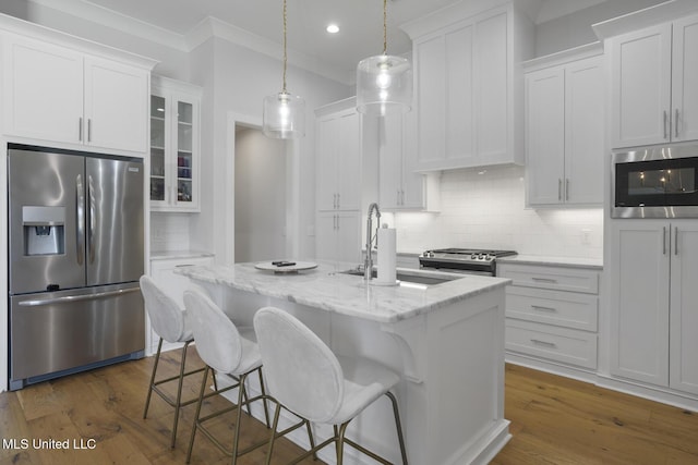 168 Shore View Dr, Madison, MS 39110 - kitchen with stainless steel appliances, ornamental molding, tasteful backsplash, glass insert cabinets, and white cabinetry