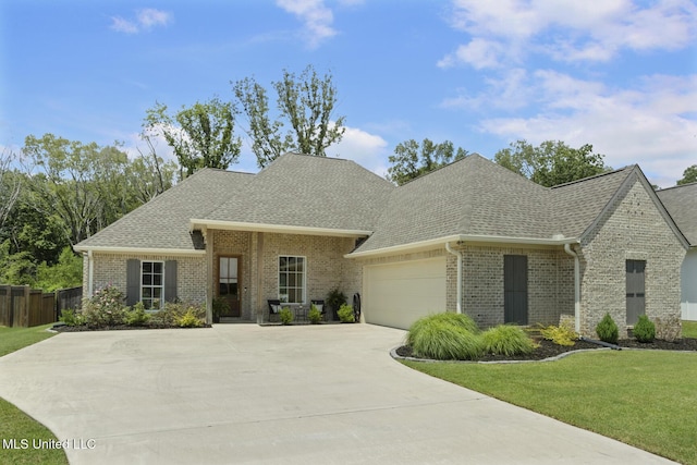168 Shore View Dr, Madison, MS 39110 - view of front of home with a shingled roof, brick siding, an attached garage, and concrete driveway