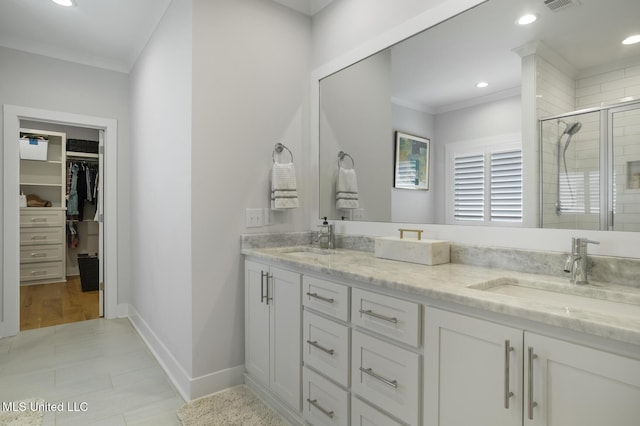 168 Shore View Dr, Madison, MS 39110 - full bath featuring ornamental molding, double vanity, a stall shower, a walk in closet, and recessed lighting