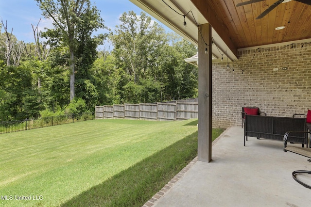 168 Shore View Dr, Madison, MS 39110 - fenced backyard featuring ceiling fan, a patio area, and view of scattered trees