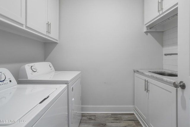 168 Shore View Dr, Madison, MS 39110 - laundry room with separate washer and dryer, cabinet space, and dark wood-style floors