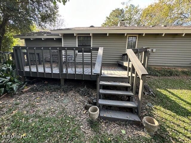 back of property with a deck