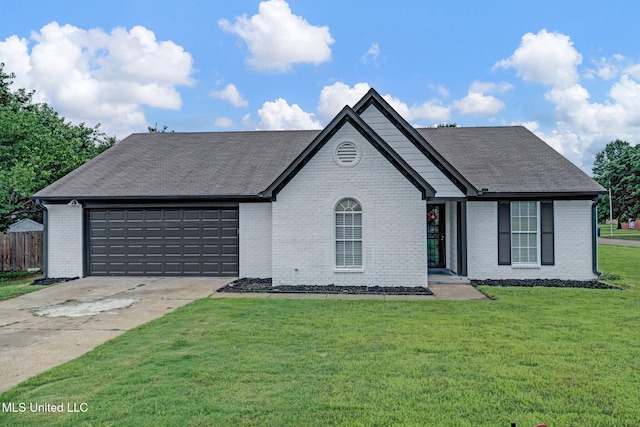 10326 Amanda Dr, Olive Branch, MS 38654 - view of front of house featuring an attached garage, driveway, brick siding, and a shingled roof
