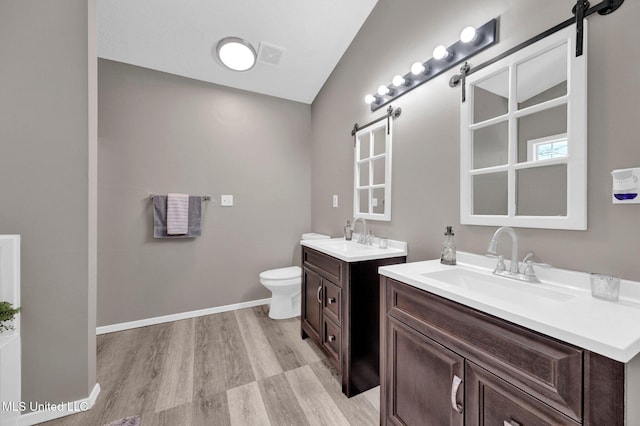 10326 Amanda Dr, Olive Branch, MS 38654 - full bathroom with wood finished floors and two vanities