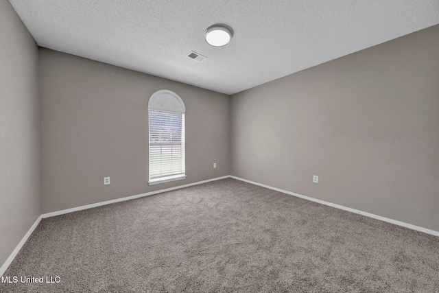 10326 Amanda Dr, Olive Branch, MS 38654 - empty room featuring carpet flooring and a textured ceiling
