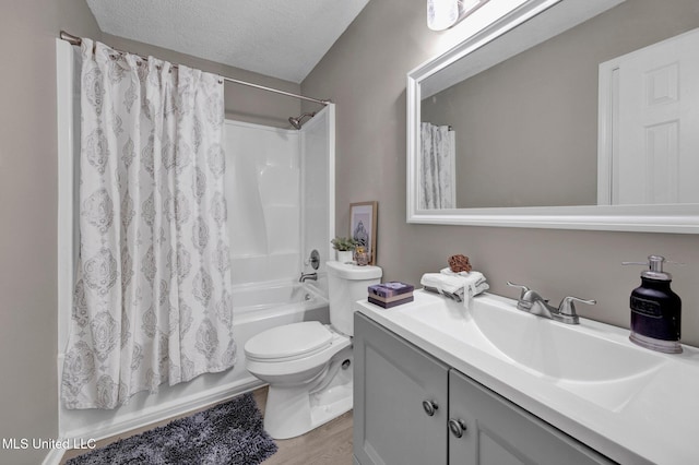 10326 Amanda Dr, Olive Branch, MS 38654 - bathroom with shower / bath combo, vanity, a textured ceiling, and wood finished floors