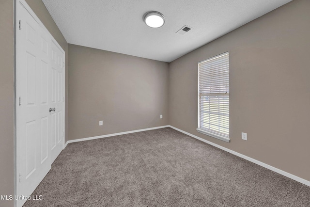 10326 Amanda Dr, Olive Branch, MS 38654 - unfurnished bedroom featuring carpet flooring and multiple windows
