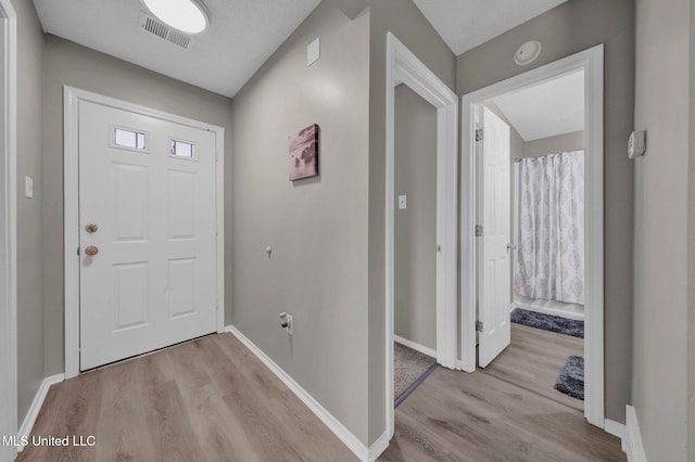 10326 Amanda Dr, Olive Branch, MS 38654 - entryway featuring light wood finished floors and baseboards