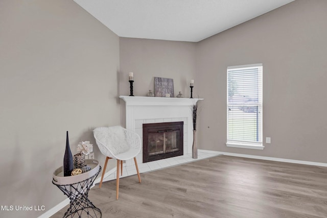 10326 Amanda Dr, Olive Branch, MS 38654 - living room featuring a tiled fireplace and wood finished floors