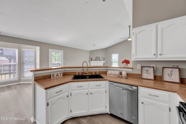 10326 Amanda Dr, Olive Branch, MS 38654 - kitchen featuring dishwasher, a peninsula, ceiling fan, plenty of natural light, and lofted ceiling