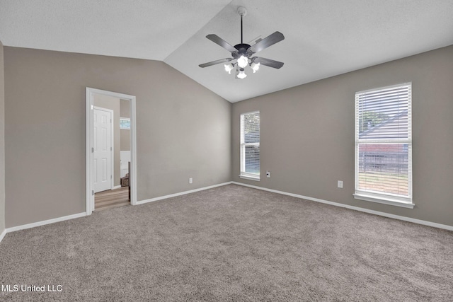 10326 Amanda Dr, Olive Branch, MS 38654 - unfurnished room featuring carpet, plenty of natural light, lofted ceiling, and a ceiling fan