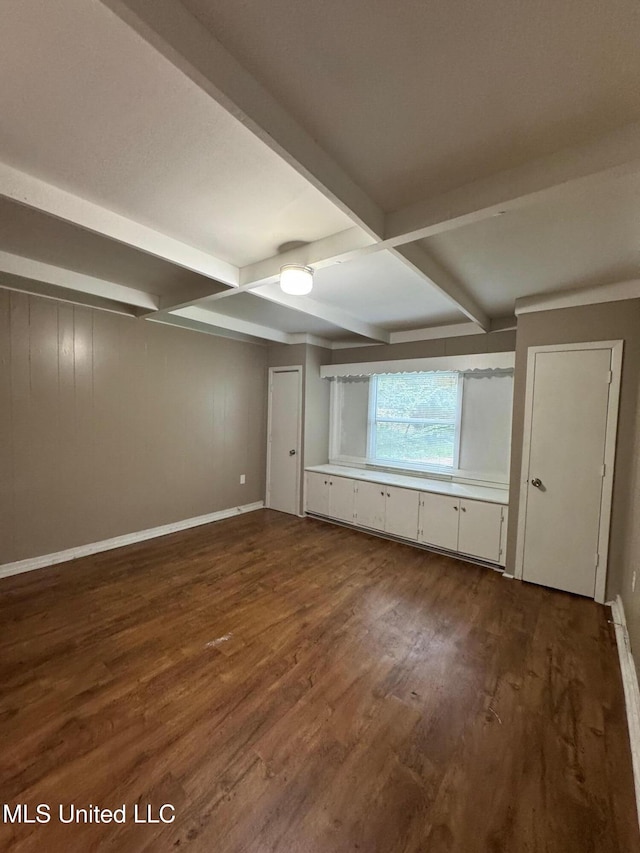 3115 Shirley Dr, Jackson, MS 39212 - unfurnished room featuring dark wood-style floors and beamed ceiling