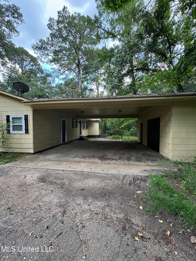 3115 Shirley Dr, Jackson, MS 39212 - view of vehicle parking with an attached carport and asphalt driveway