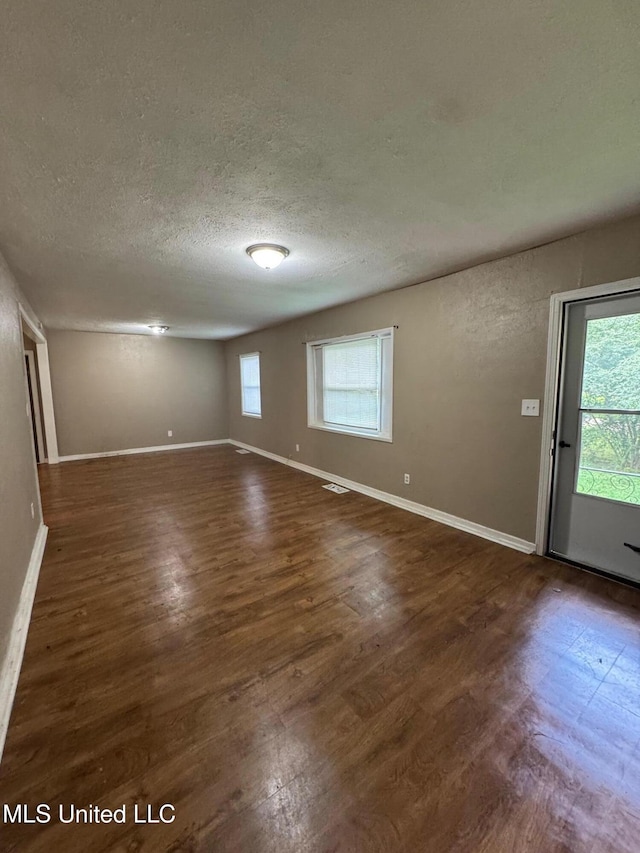 3115 Shirley Dr, Jackson, MS 39212 - spare room featuring wood finished floors and a textured ceiling
