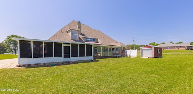 1000 Cedar Hill Rd, Madison, MS 39110 - back of property with a sunroom, a storage unit, a yard, and an outdoor structure