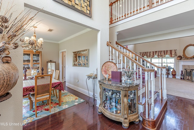 1000 Cedar Hill Rd, Madison, MS 39110 - dining room featuring a chandelier, crown molding, stairway, wood finished floors, and baseboards