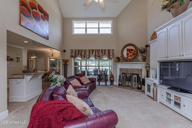 1000 Cedar Hill Rd, Madison, MS 39110 - living area featuring high vaulted ceiling, a ceiling fan, light carpet, a tile fireplace, and baseboards