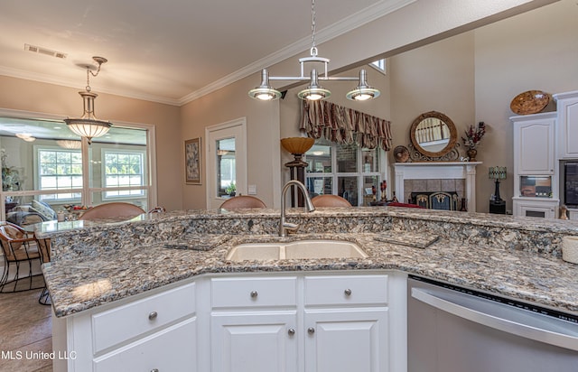 1000 Cedar Hill Rd, Madison, MS 39110 - kitchen with dishwasher, a sink, a fireplace, light stone countertops, and crown molding