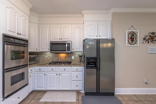 1000 Cedar Hill Rd, Madison, MS 39110 - kitchen with appliances with stainless steel finishes, white cabinets, stone countertops, decorative backsplash, and light tile patterned floors