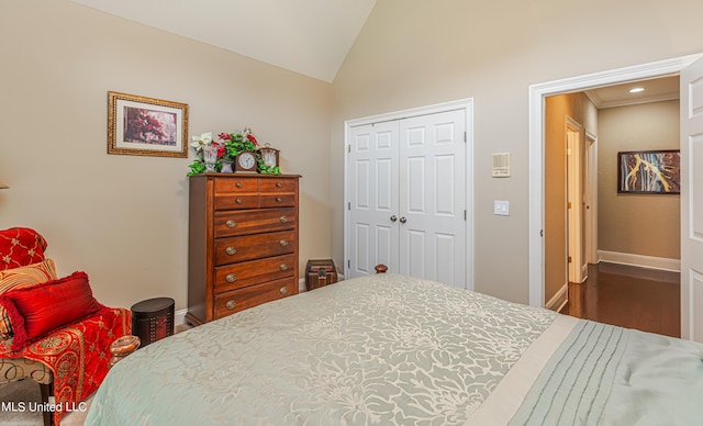 1000 Cedar Hill Rd, Madison, MS 39110 - bedroom featuring vaulted ceiling, baseboards, a closet, and wood finished floors