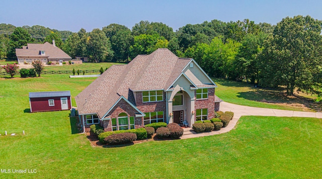 1000 Cedar Hill Rd, Madison, MS 39110 - view of front facade featuring a front yard, brick siding, and an outdoor structure