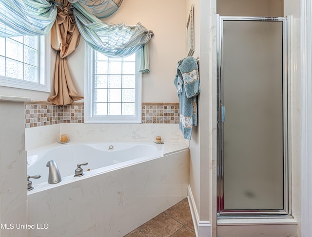 1000 Cedar Hill Rd, Madison, MS 39110 - full bath featuring a stall shower, a garden tub, and tile patterned flooring